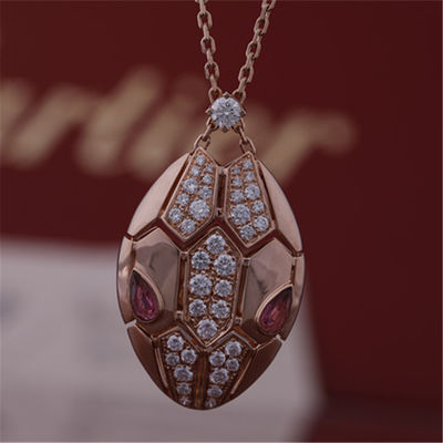 Chất lượng Vòng cổ Serpenti La Mã bằng vàng hồng 18 kt với mắt rubellite và trên đầu có đính kim cương pavé nhà máy