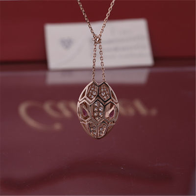 Chất lượng Vòng cổ Serpenti La Mã bằng vàng hồng 18 kt với mắt rubellite và trên đầu có đính kim cương pavé nhà máy